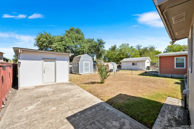 a house view with a backyard space