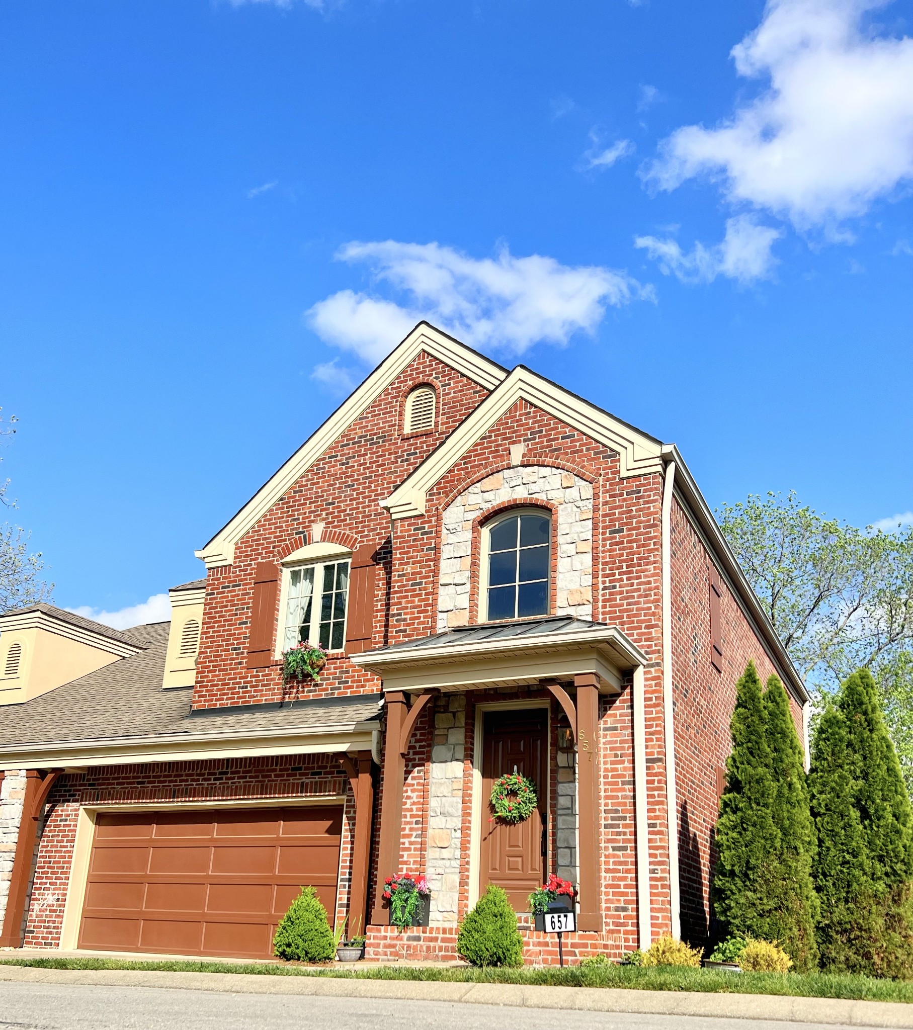 657 Nickolas Drive, Unit 657 Lebanon, TN 37087 - Photo 2 of 27 a front view of a house with garden