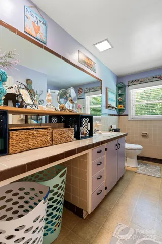 a kitchen with stainless steel appliances a sink and a stove