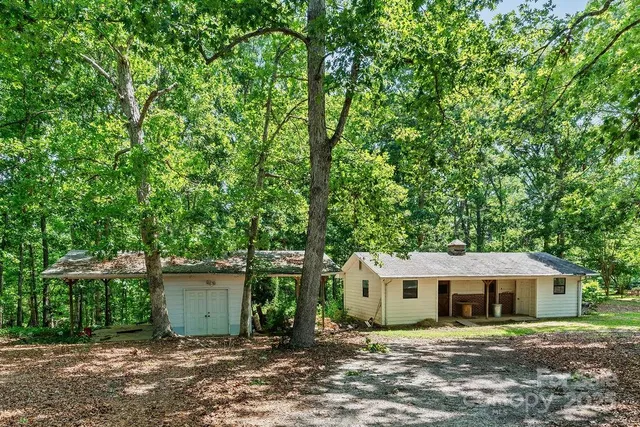 front view of a house with a tree