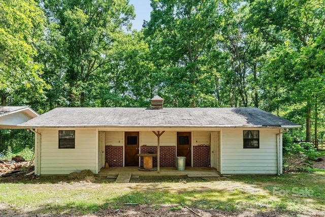 front view of a house with a backyard