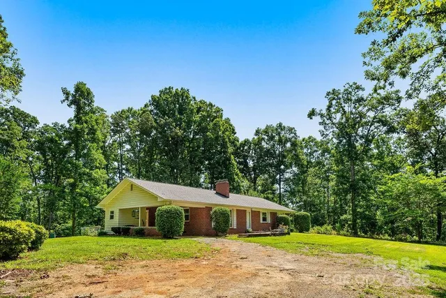 a house with trees in the background