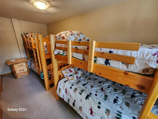 a bedroom with furniture and a large mirror