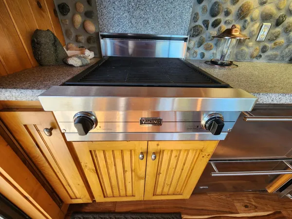 a kitchen with a stove and a microwave