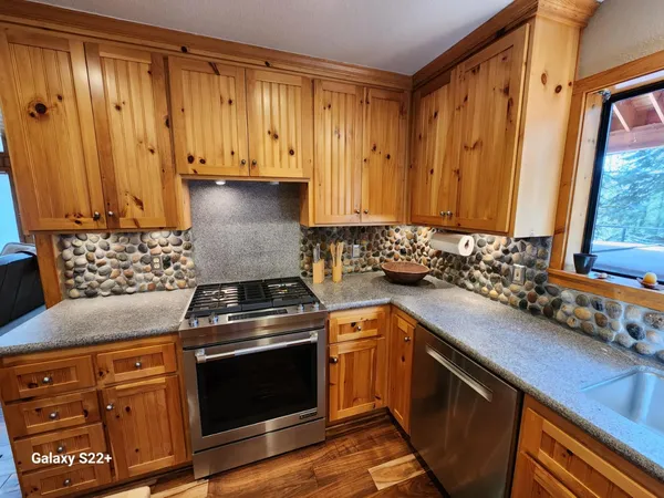 a kitchen with a stove and a sink