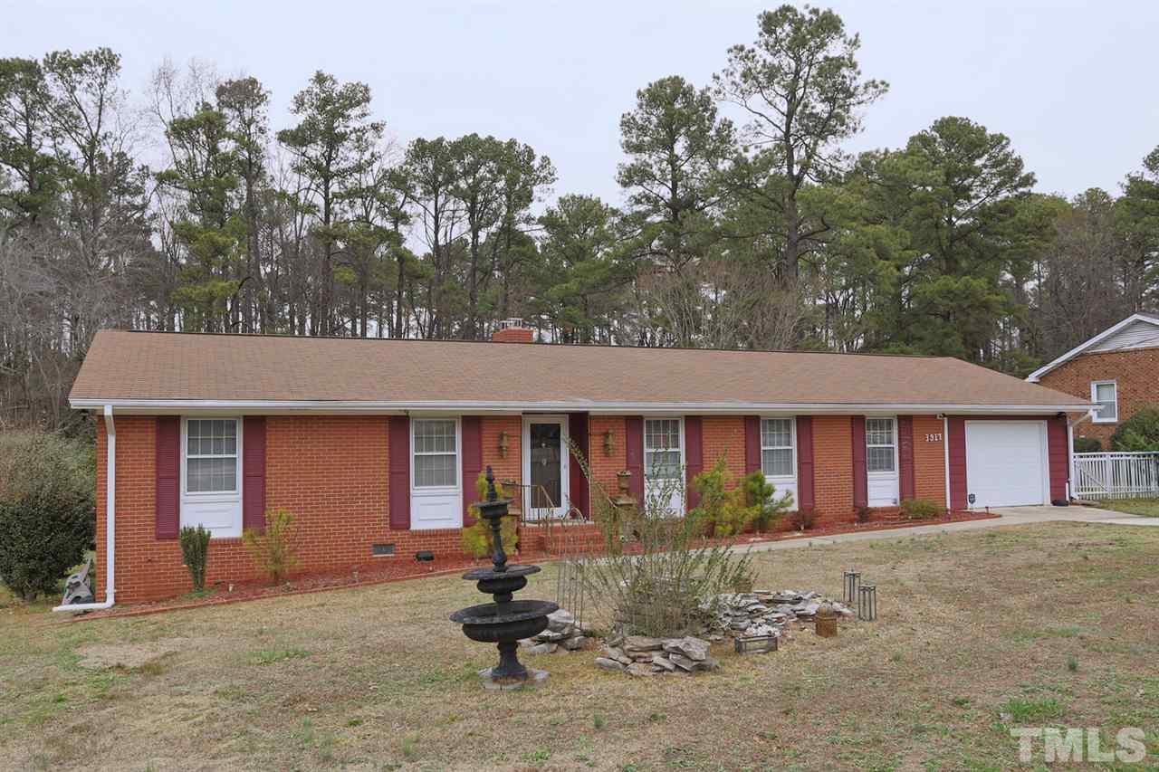 3917 Buffaloe Road Raleigh, NC 27604 - Photo 1 of 24 front view of a house with a yard