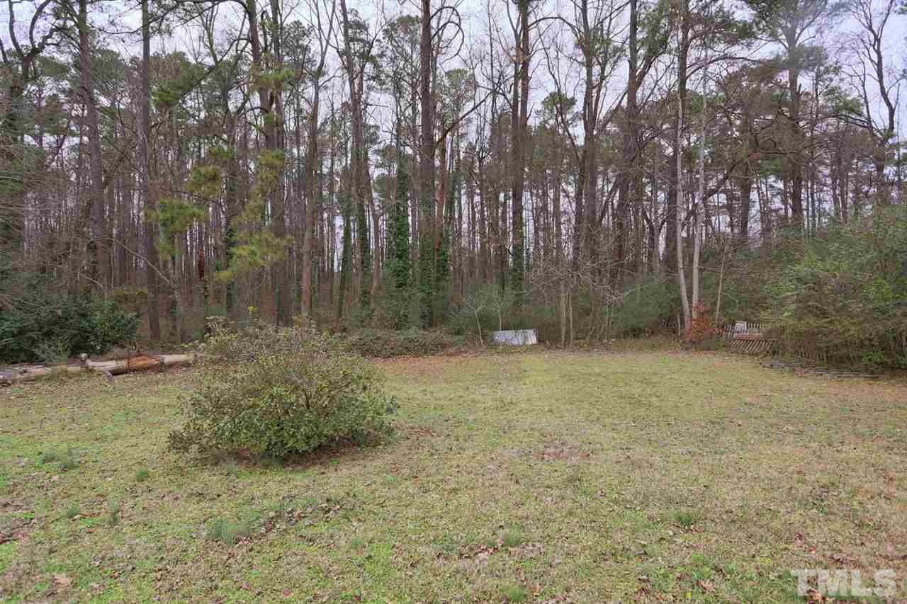 3917 Buffaloe Road Raleigh, NC 27604 - Photo 22 of 24 a backyard of a house with lots of green space