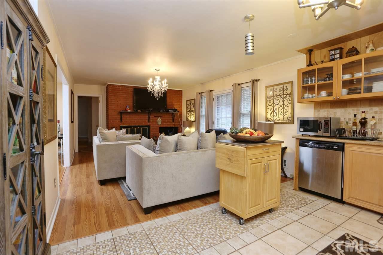 3917 Buffaloe Road Raleigh, NC 27604 - Photo 6 of 24 a living room with furniture and a kitchen view