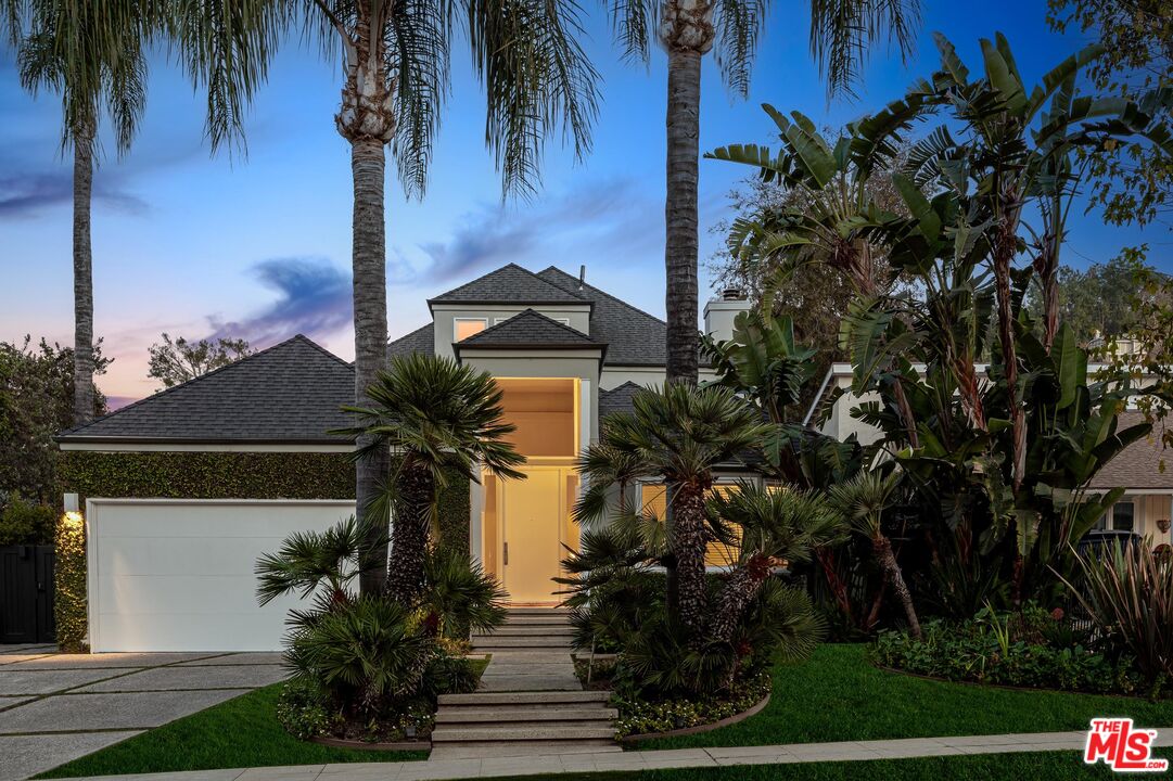 4216 Woodcliff Road Sherman Oaks, CA 91403 - Photo 1 of 56 a front view of a house with a tree