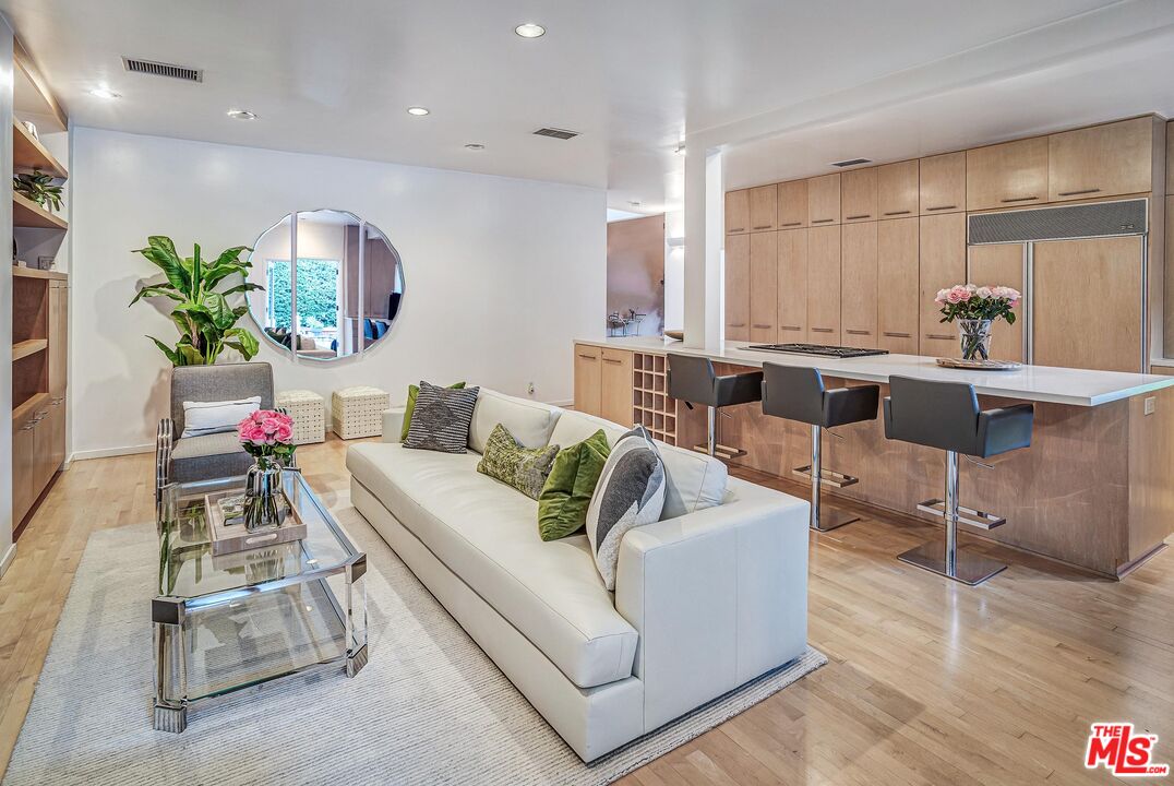 4216 Woodcliff Road Sherman Oaks, CA 91403 - Photo 12 of 56 a living room with furniture and a large window