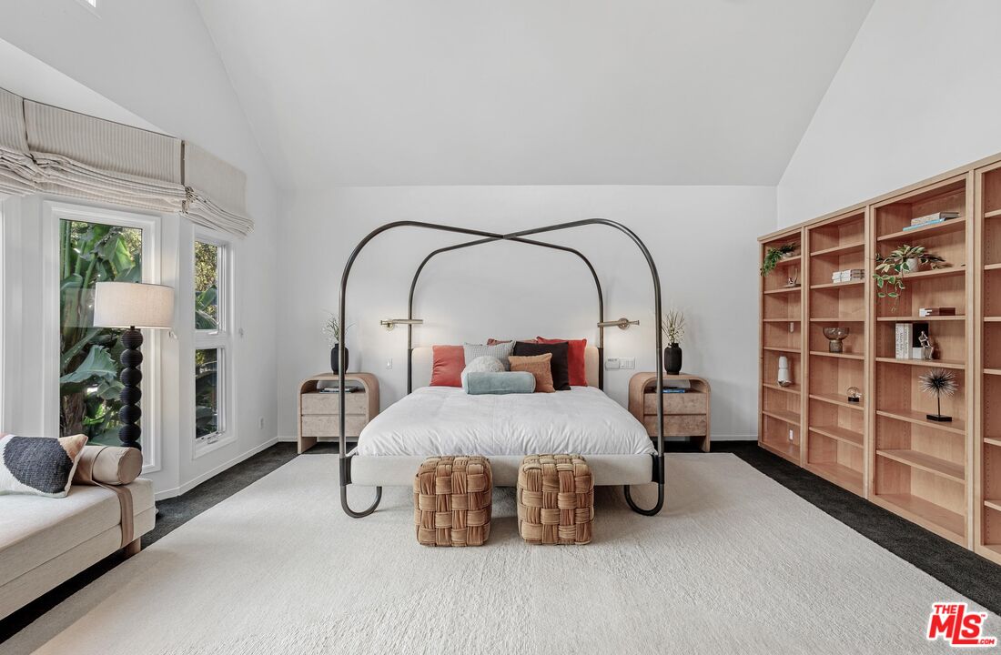 4216 Woodcliff Road Sherman Oaks, CA 91403 - Photo 13 of 56 a bedroom with bed and a bookshelf