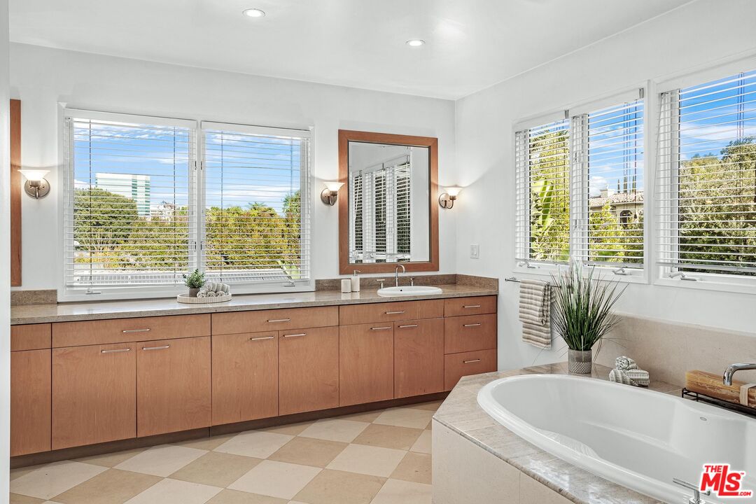 4216 Woodcliff Road Sherman Oaks, CA 91403 - Photo 18 of 56 a large bathroom with a large tub and sink