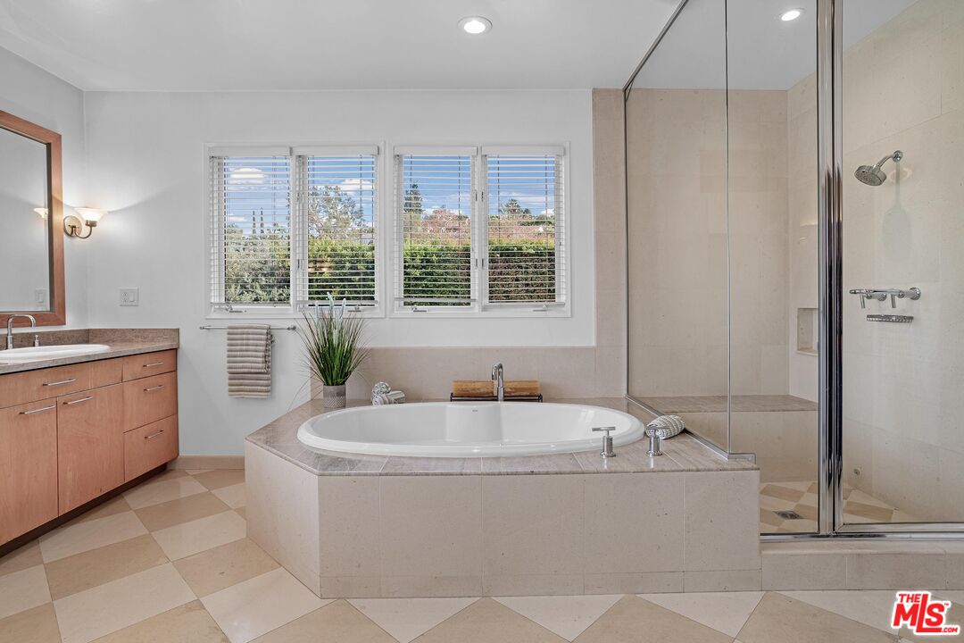 4216 Woodcliff Road Sherman Oaks, CA 91403 - Photo 19 of 56 a bathroom with a bathtub and a sink