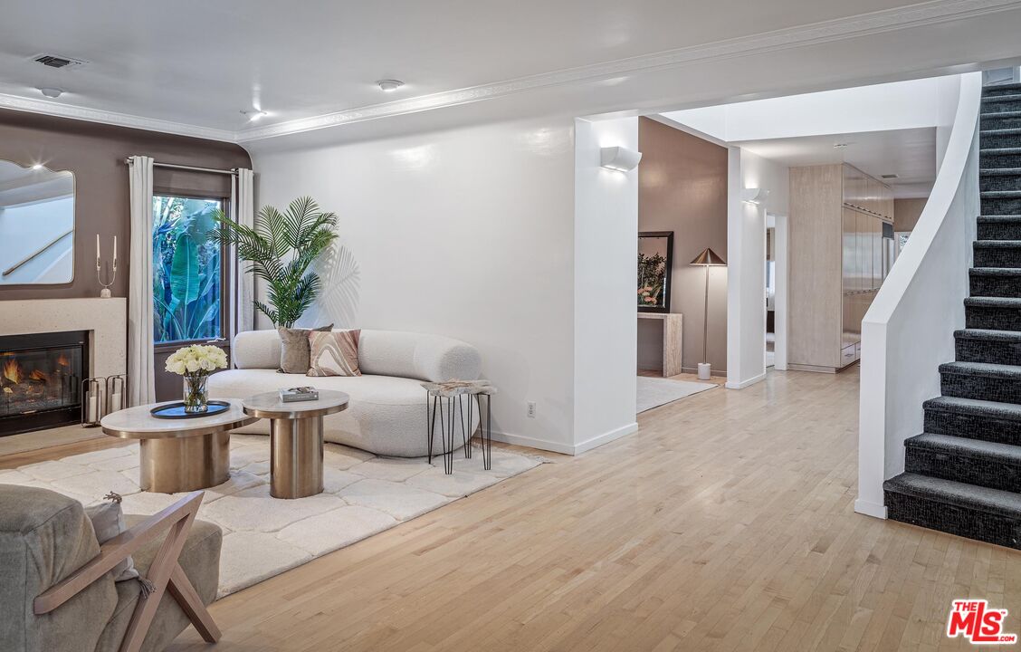 4216 Woodcliff Road Sherman Oaks, CA 91403 - Photo 2 of 56 a living room with furniture and a fireplace