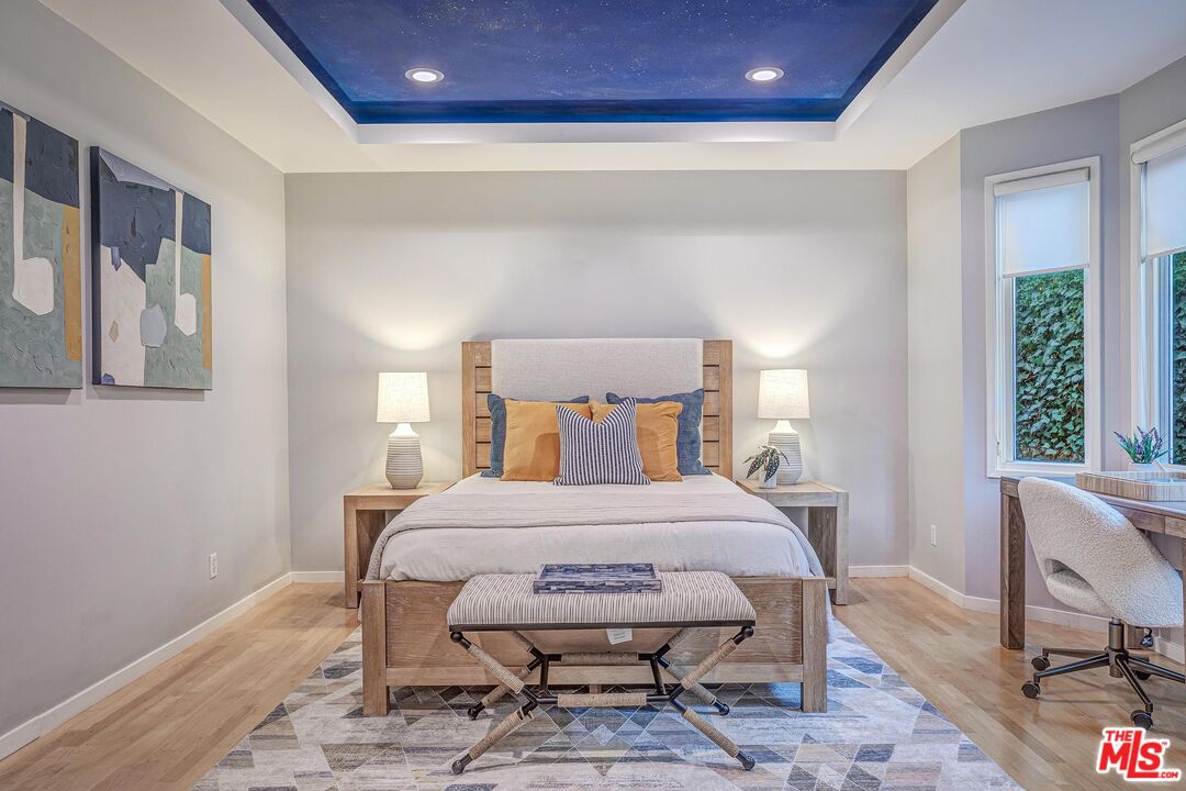 4216 Woodcliff Road Sherman Oaks, CA 91403 - Photo 26 of 56 a bedroom with a bed a table and chair