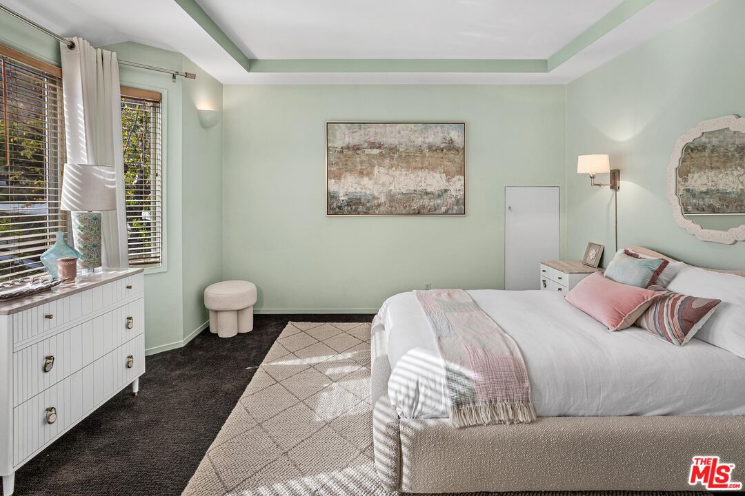 4216 Woodcliff Road Sherman Oaks, CA 91403 - Photo 29 of 56 a bedroom with a bed and window