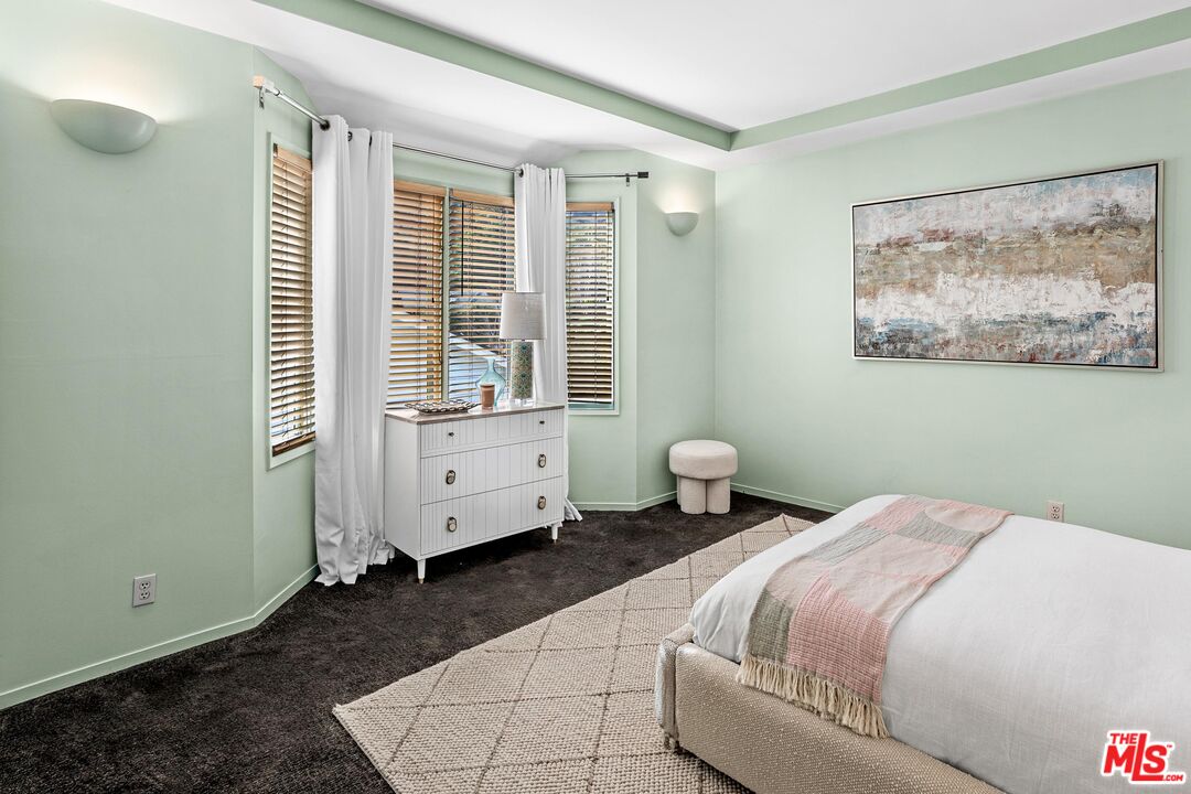 4216 Woodcliff Road Sherman Oaks, CA 91403 - Photo 30 of 56 a bedroom with a bed and a window