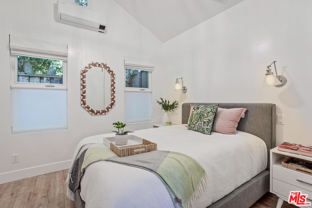 4216 Woodcliff Road Sherman Oaks, CA 91403 - Photo 42 of 56 a bedroom with bed and window