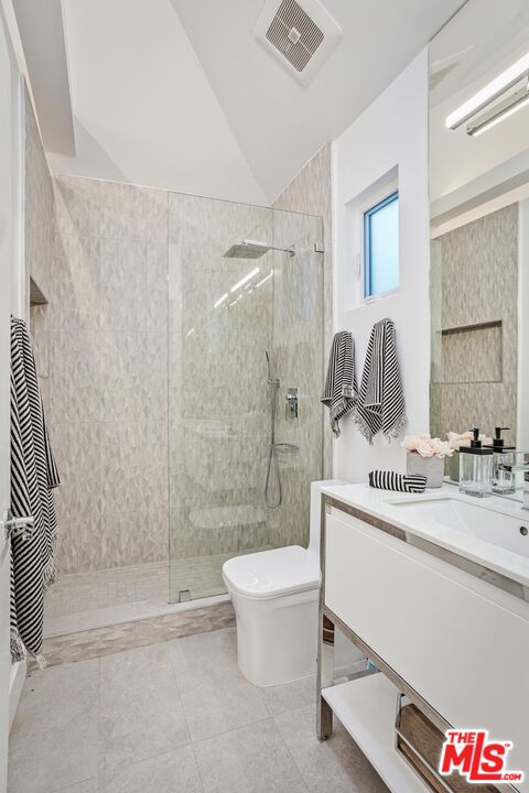 4216 Woodcliff Road Sherman Oaks, CA 91403 - Photo 45 of 56 a bathroom with a sink a toilet and shower
