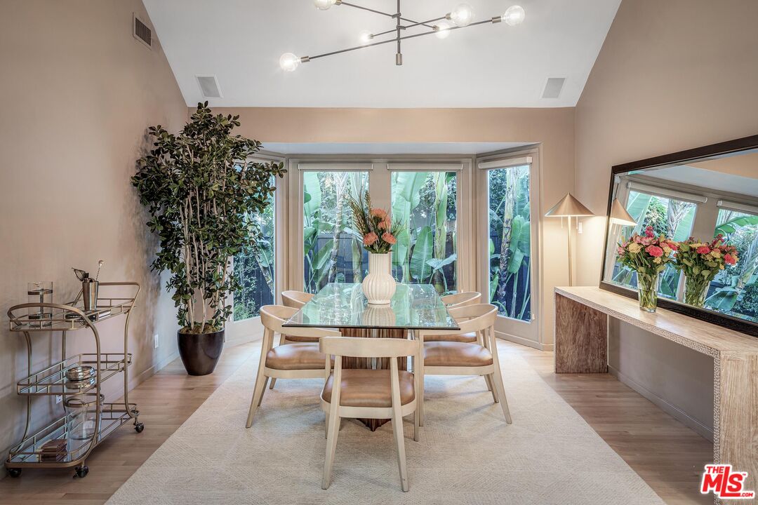 4216 Woodcliff Road Sherman Oaks, CA 91403 - Photo 5 of 56 a dining room with furniture garden view and a potted plant
