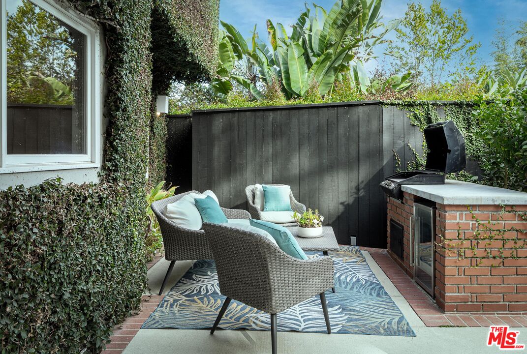 4216 Woodcliff Road Sherman Oaks, CA 91403 - Photo 52 of 56 a view of a chairs and table in the balcony