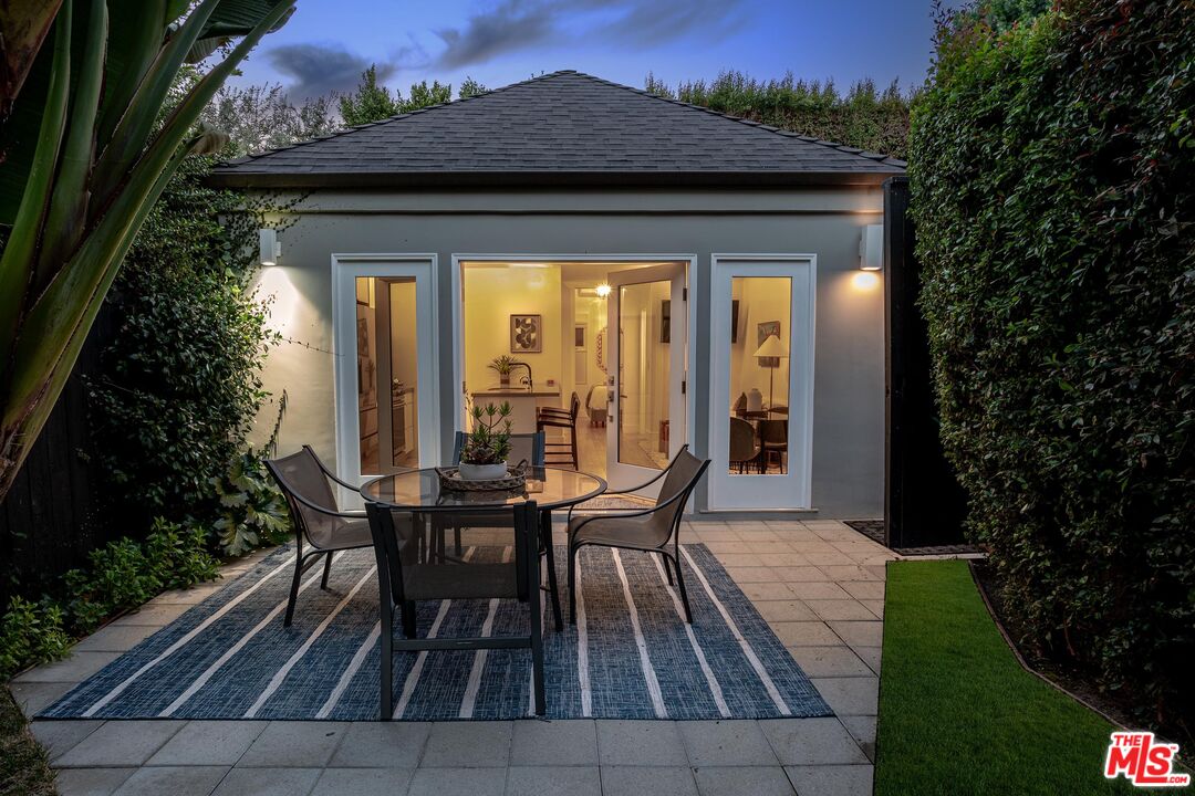 4216 Woodcliff Road Sherman Oaks, CA 91403 - Photo 55 of 56 a view of a house with backyard sitting area and garden