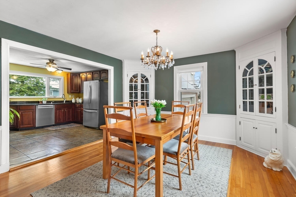 32 Kings Beach Terrace Swampscott, MA 01907 - Photo 19 of 40 a dining room with furniture a chandelier and wooden floor