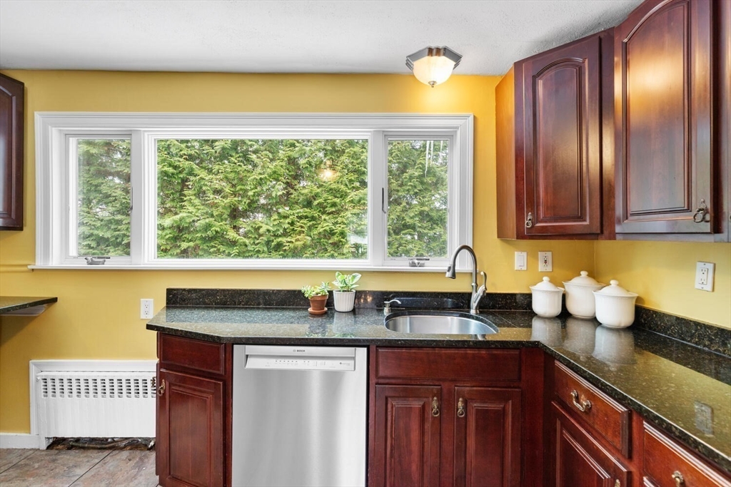 32 Kings Beach Terrace Swampscott, MA 01907 - Photo 21 of 40 a kitchen with granite countertop a sink and a window