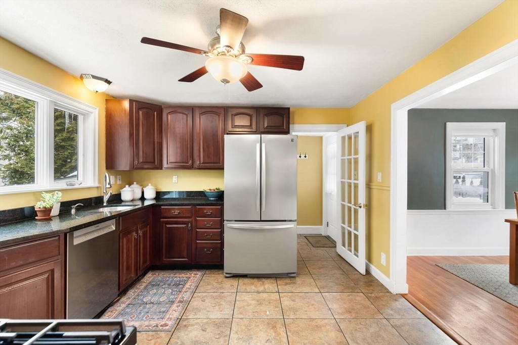 32 Kings Beach Terrace Swampscott, MA 01907 - Photo 22 of 40 a kitchen with granite countertop a refrigerator a sink and dishwasher