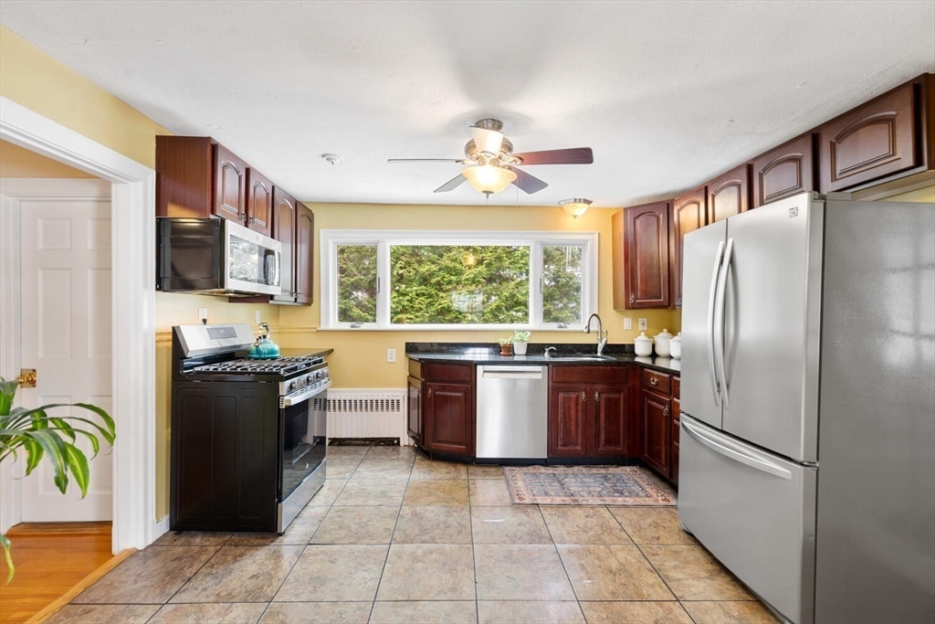 32 Kings Beach Terrace Swampscott, MA 01907 - Photo 23 of 40 a kitchen with a stove top oven and refrigerator