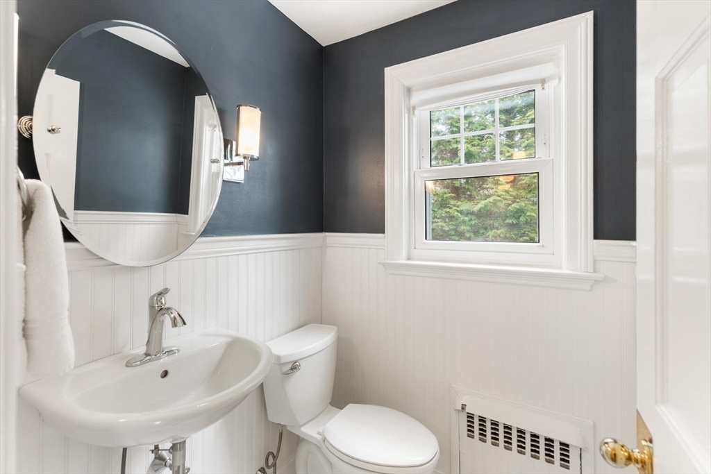 32 Kings Beach Terrace Swampscott, MA 01907 - Photo 24 of 40 a bathroom with a toilet a sink and a mirror
