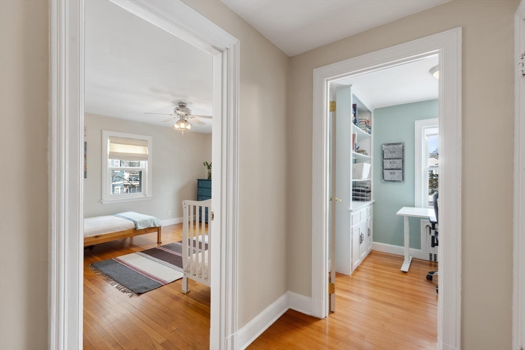 32 Kings Beach Terrace Swampscott, MA 01907 - Photo 32 of 40 a view of a bedroom with wooden floor and furniture