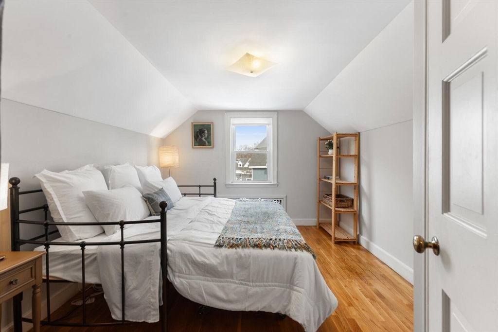 32 Kings Beach Terrace Swampscott, MA 01907 - Photo 34 of 40 a bedroom with a bed and a couch