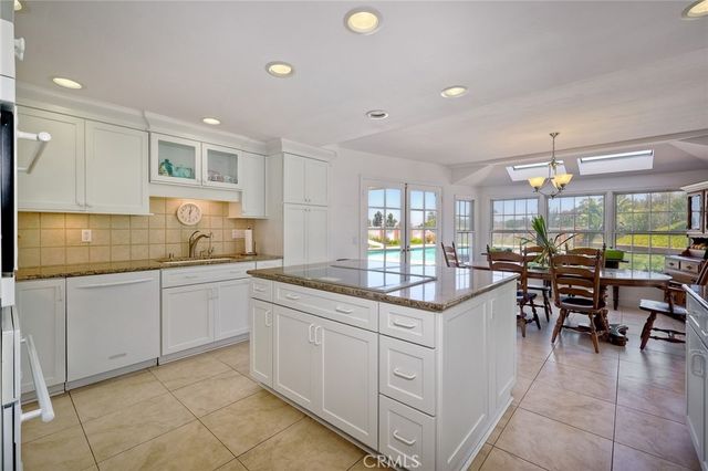 a bedroom with a bed dresser and a window