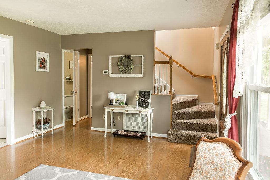 1085 Kathryn Road Mount Juliet, TN 37122 - Photo 5 of 25 Half bath, entrance to master bedroom and front staircase to the upstairs bedrooms.