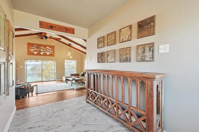 a living room with furniture and large windows