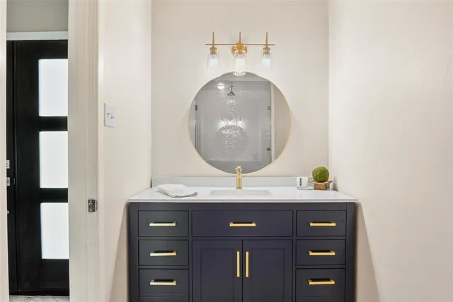 an aerial view of a house with a yard and lake view