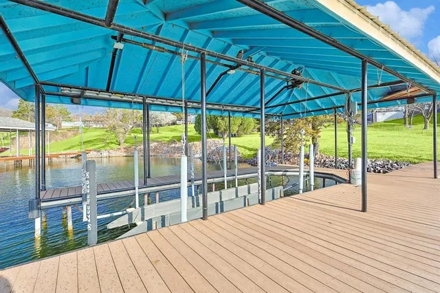 a bed room with a bed mirror and a chandelier