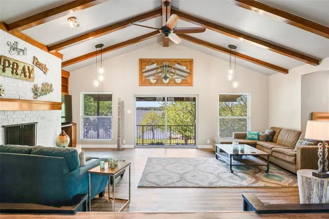 a kitchen with kitchen island a sink stove and refrigerator