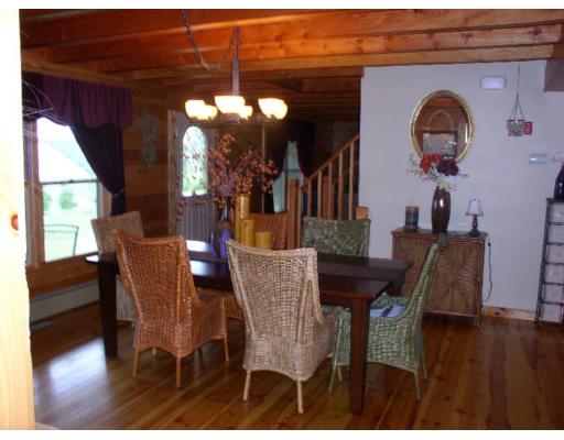122 Adams Road Grafton, MA 01536 - Photo 4 of 9 a view of a dining room with furniture and wooden floor
