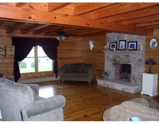 122 Adams Road Grafton, MA 01536 - Photo 5 of 9 a living room with furniture and a fireplace