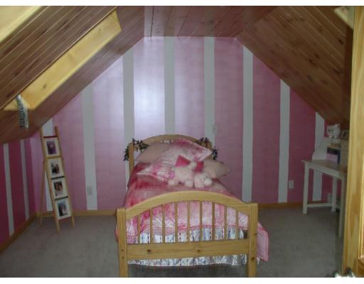 122 Adams Road Grafton, MA 01536 - Photo 9 of 9 a bedroom with a bed and a painting on the wall