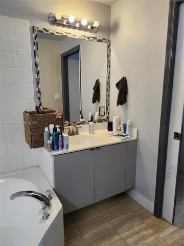 a living room with chairs and a table