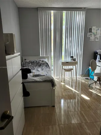 a bathroom with a sink toilet and mirror