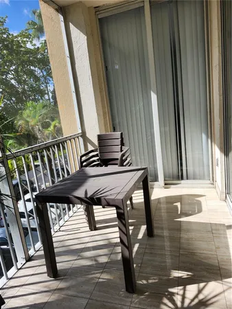 a view of a balcony with chairs