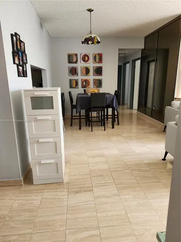 a view of kitchen with furniture and window