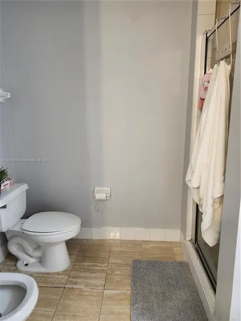 a bathroom with a tub a sink and mirror