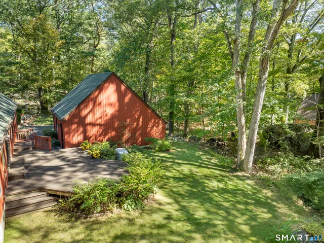 a backyard of a house with lots of green space