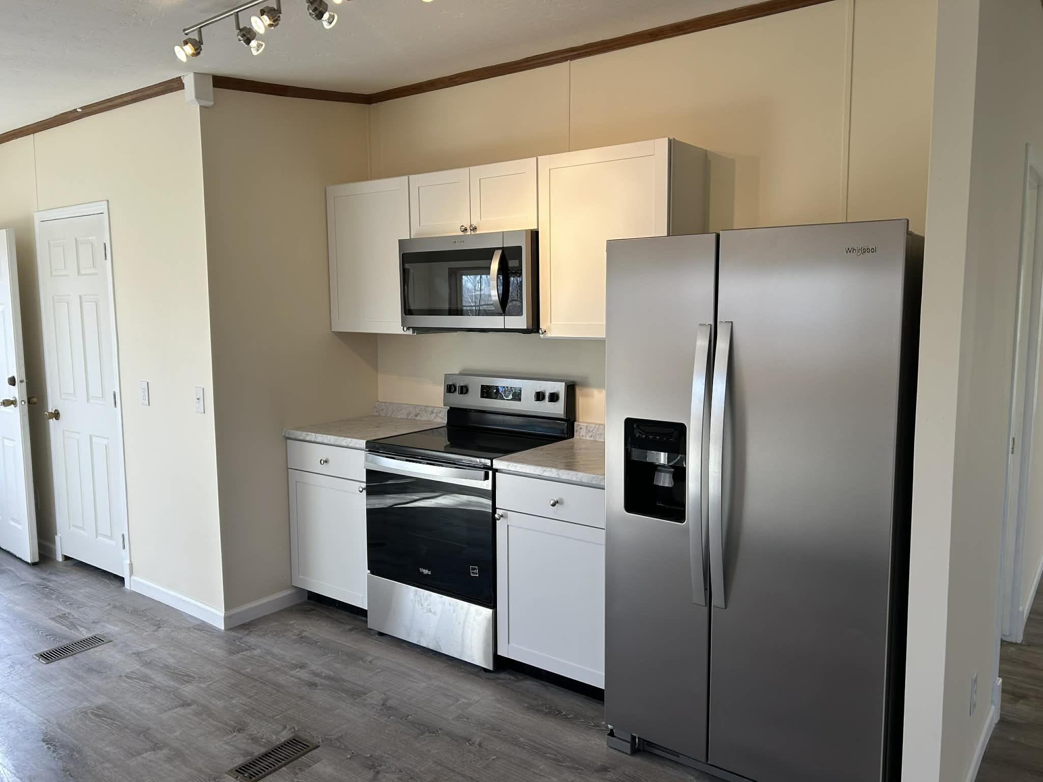 104 Bentwood Drive Blue Ridge, VA 24064 - Photo 12 of 19 a kitchen with stainless steel appliances a refrigerator stove and microwave