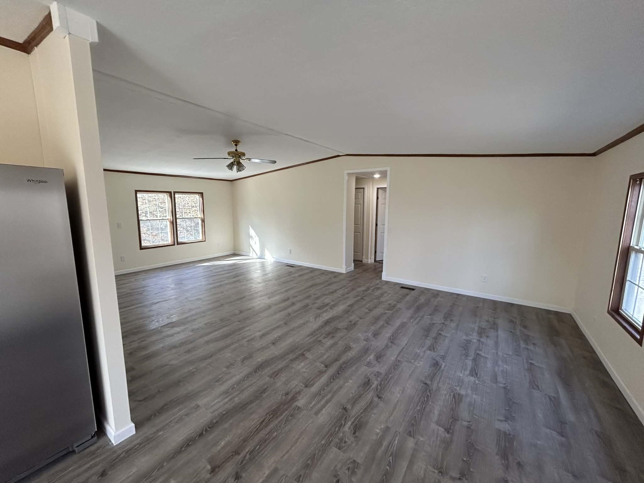 104 Bentwood Drive Blue Ridge, VA 24064 - Photo 16 of 19 an empty room with wooden floor and mirror